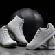 Nobull sneakers posed in front of a medicine ball